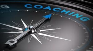 A close up of a needle pointing towards Coaching